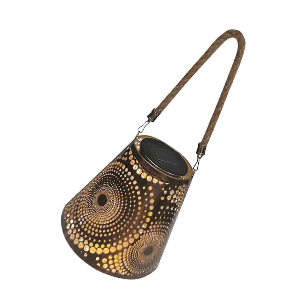 Solarpowered garden lamp with hollow design, waterproof, easy installation.