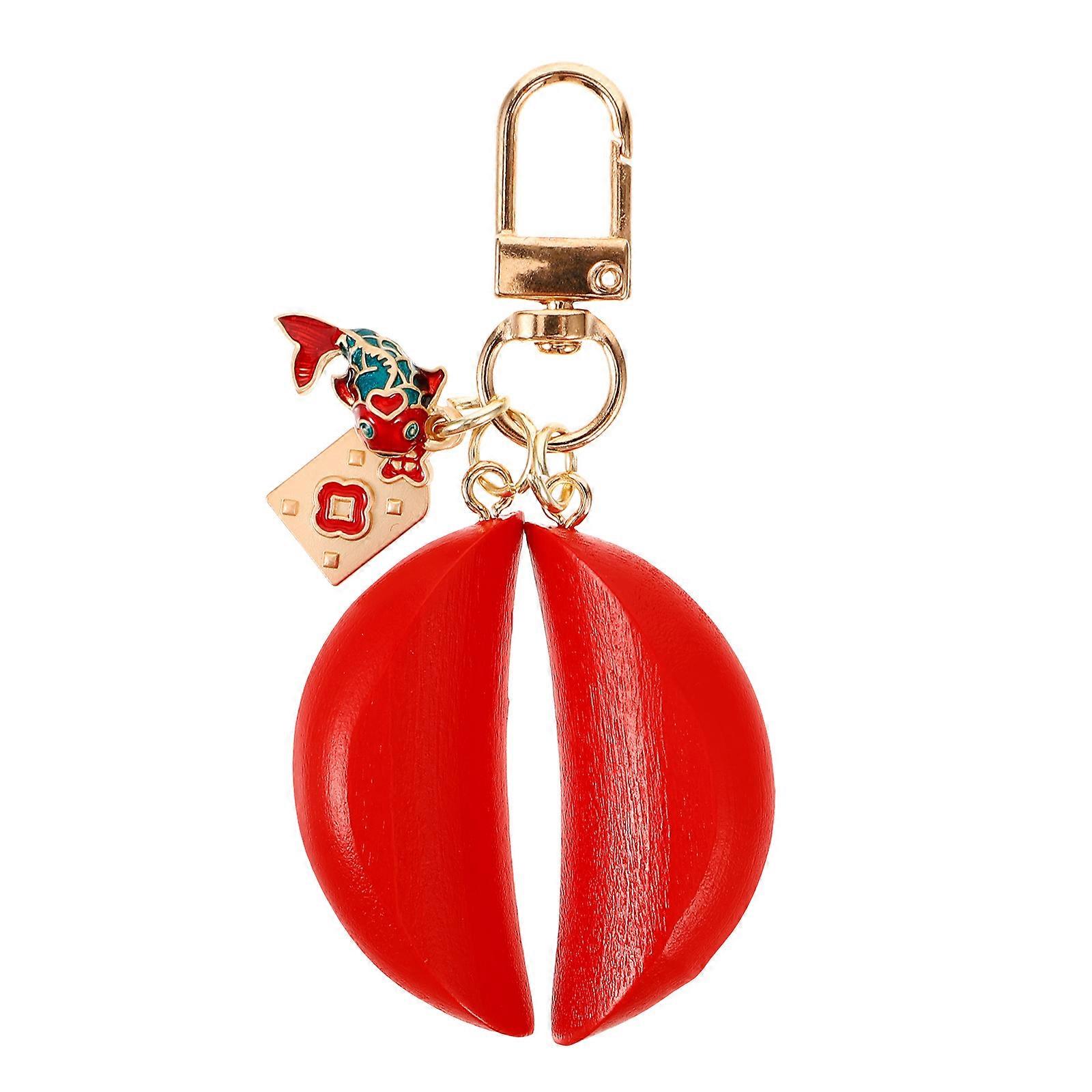 Here's a polished and professional product description based on your input:
**Decorative Key Ring with Hanging Fish Shaped Pendant – Creative