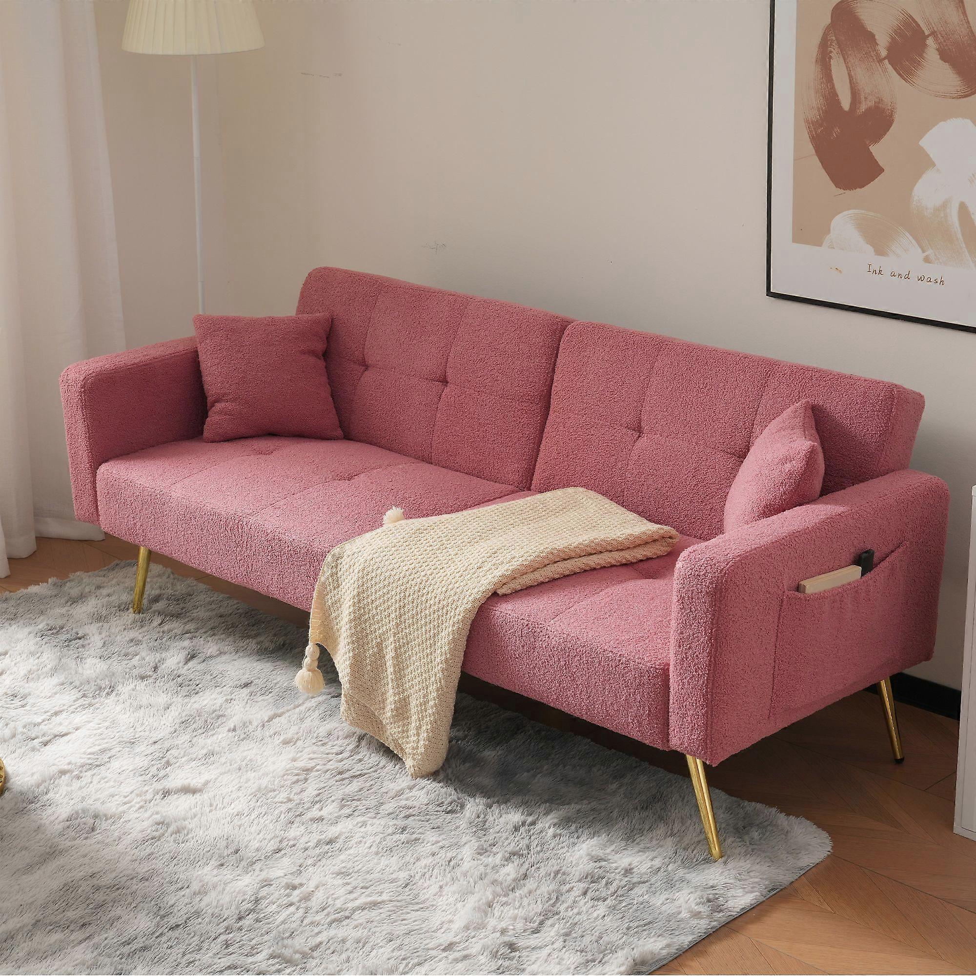 The sofa bed has a bed function, three adjustable backrest angles, gold legs, cushions and side storage pockets