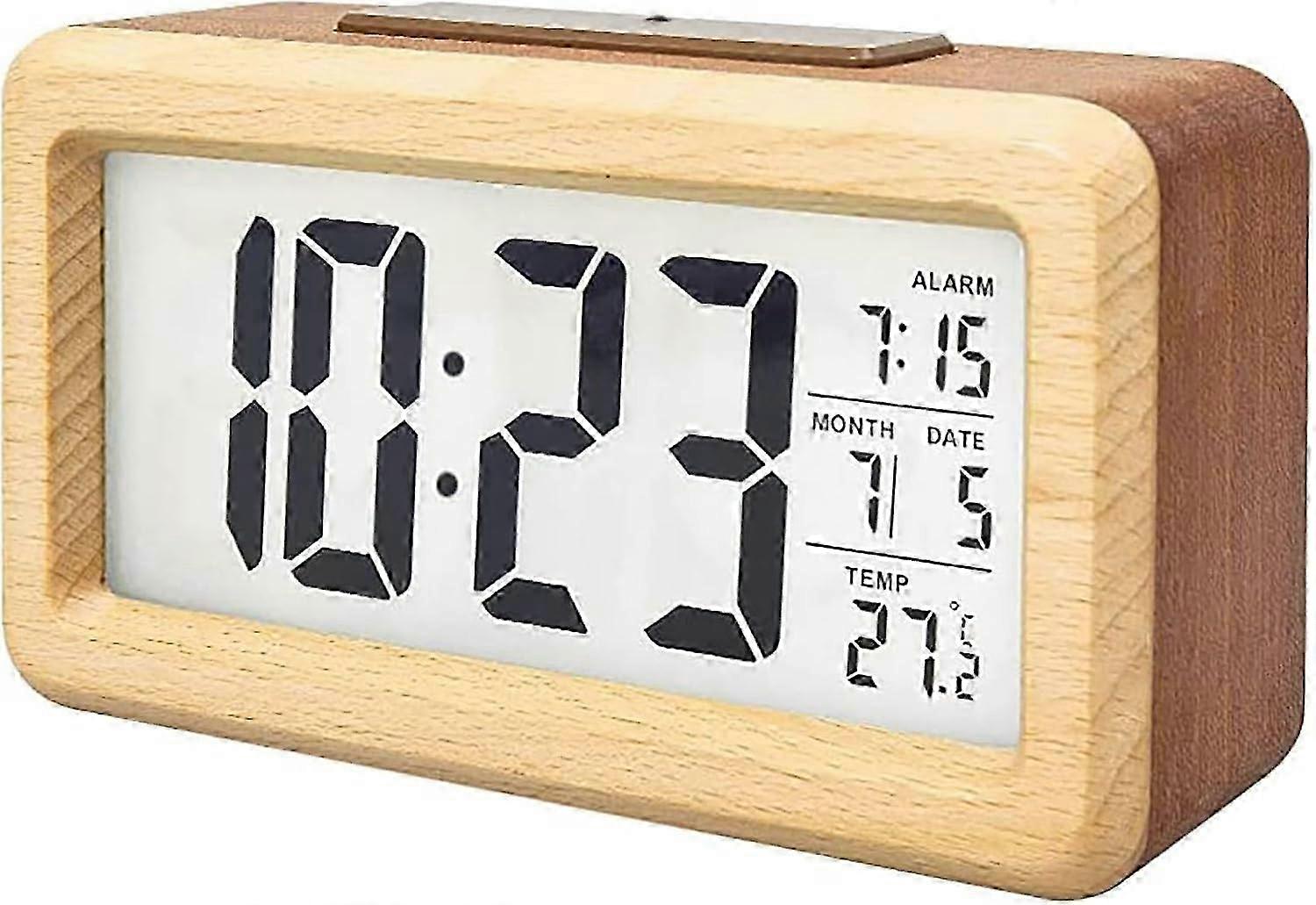 Digital LCD alarm clock, displaying temperature and date