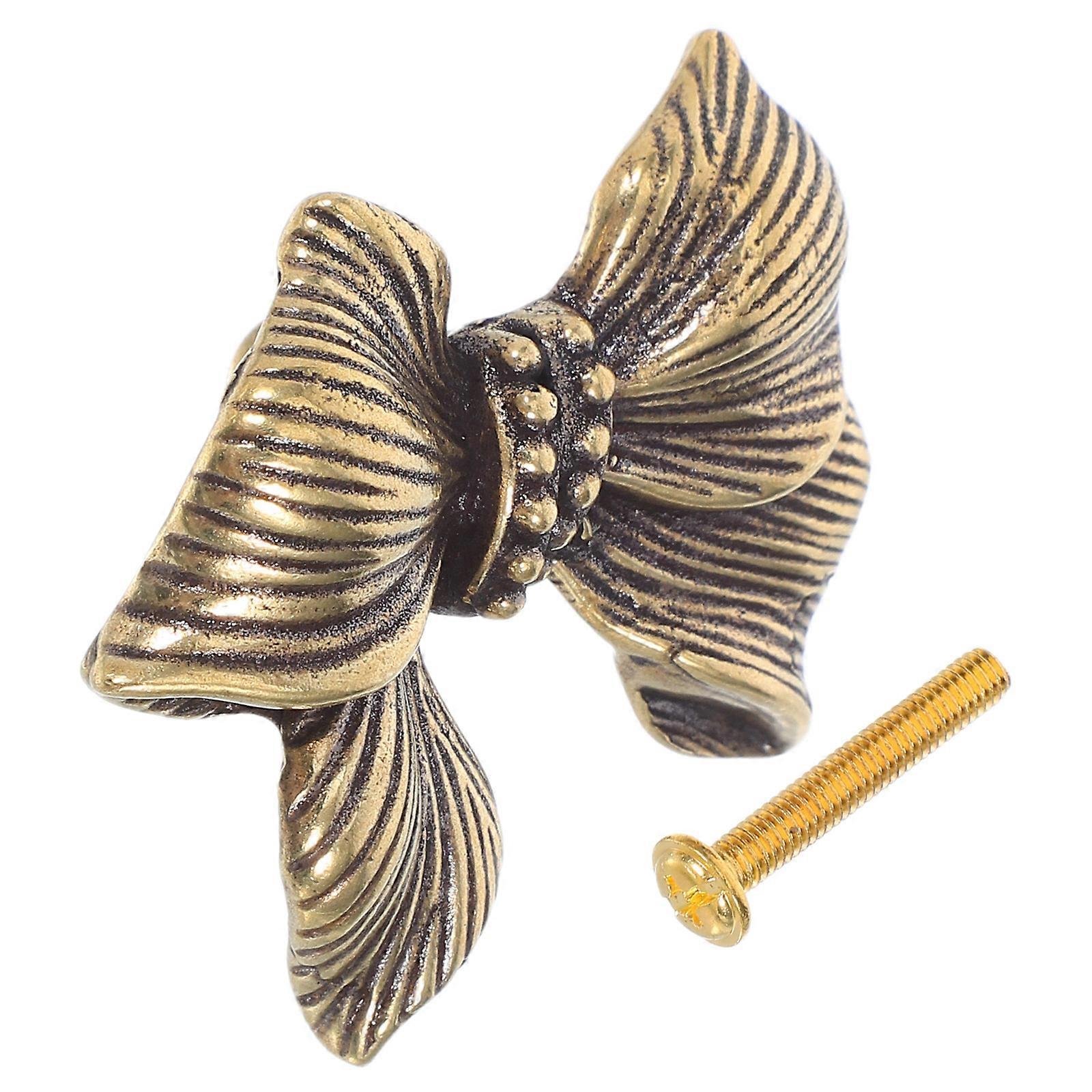 a polished and professional product description based on your input:

 

**Vintage Bow Dresser Knob – Decorative Brass Cabinet Handle for