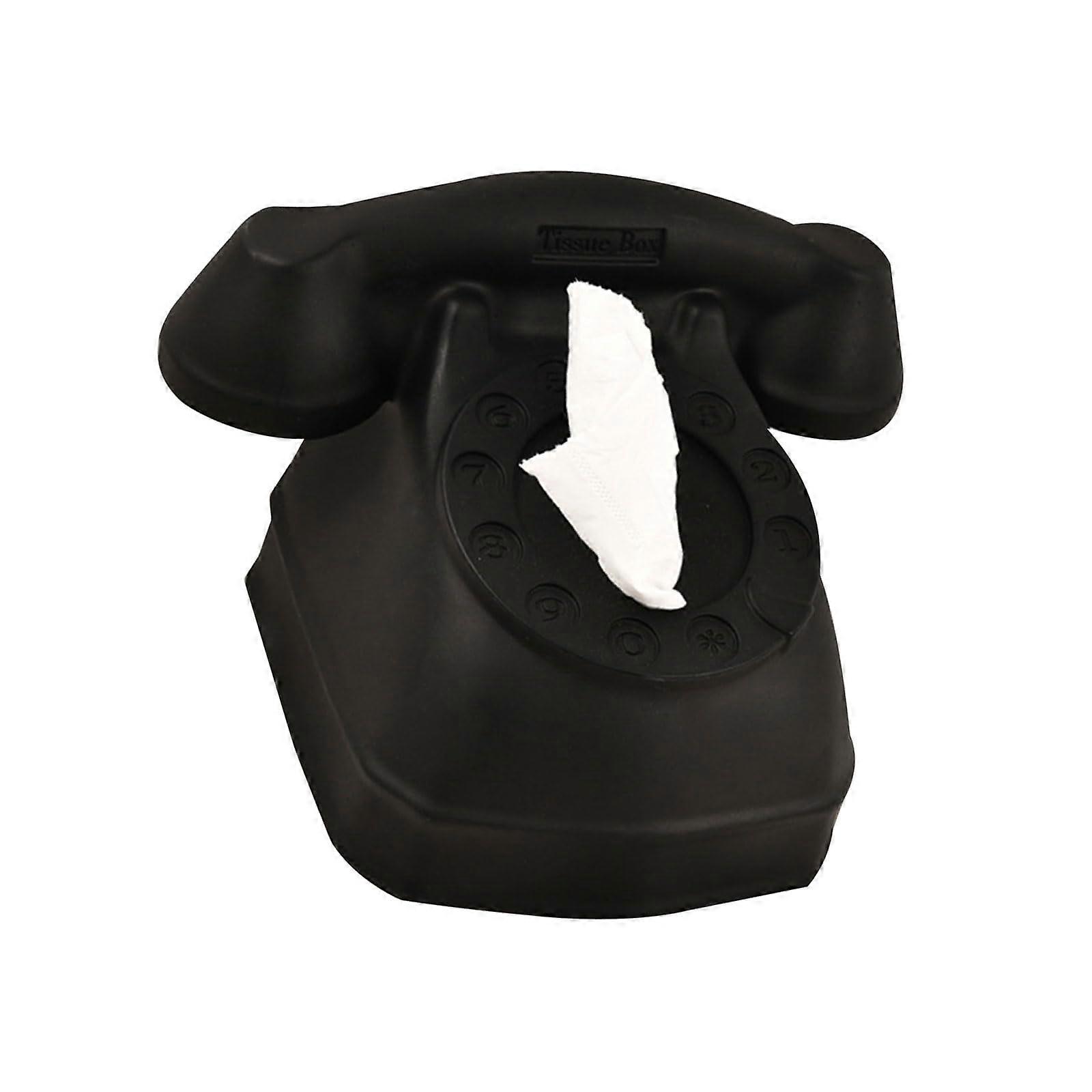 Tissue box in telephone design, stylish phoneshaped paper dispenser for a functional home in black.