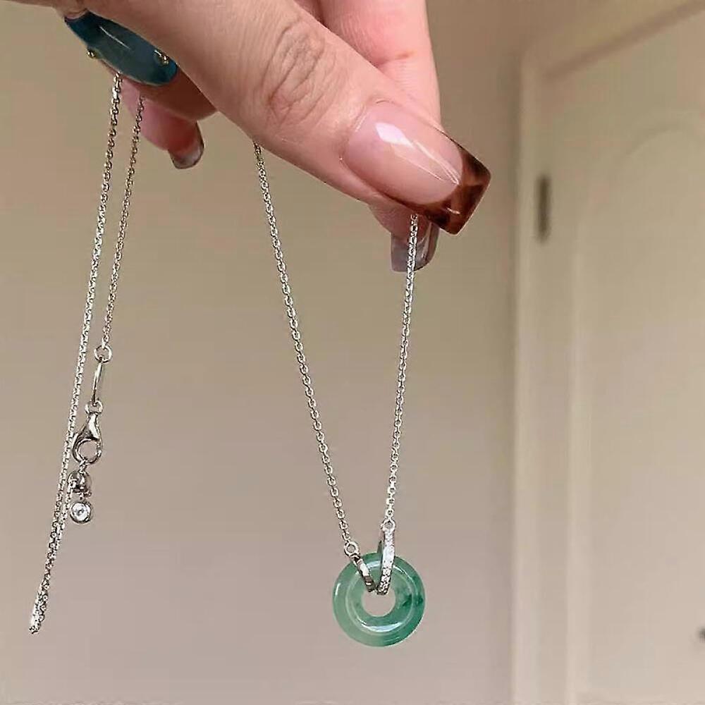 Women's chain necklace with classic interlocking ring design, an elegant accessory for both office and casual occasions.