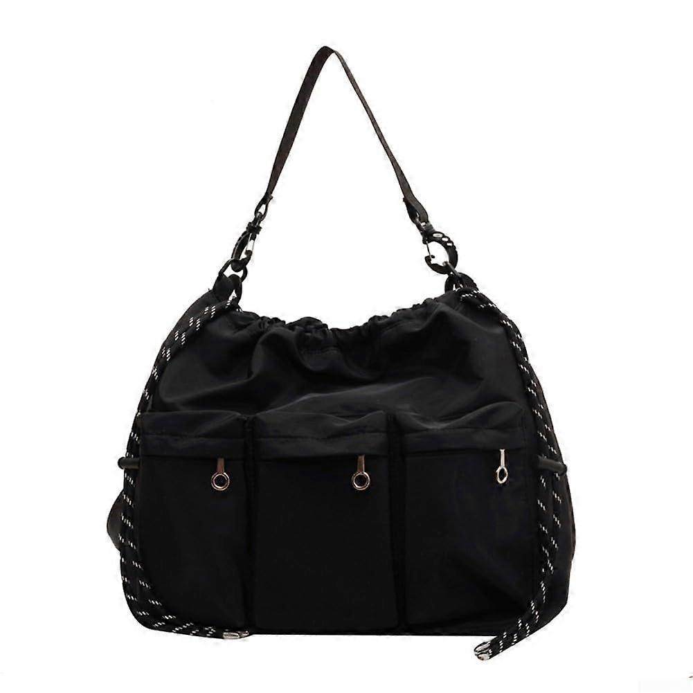 Nylon crossbody bag with multiple pockets and adjustable straps for added comfort.