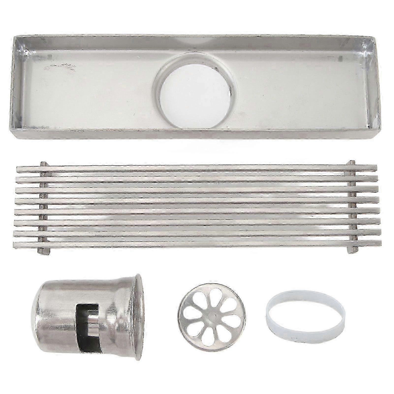Linear stainless steel shower drain channel with grate. 20 cm long. 5.5 cm wide. Rectangular. compatible with 2-inch pipes. Odor neutralization.