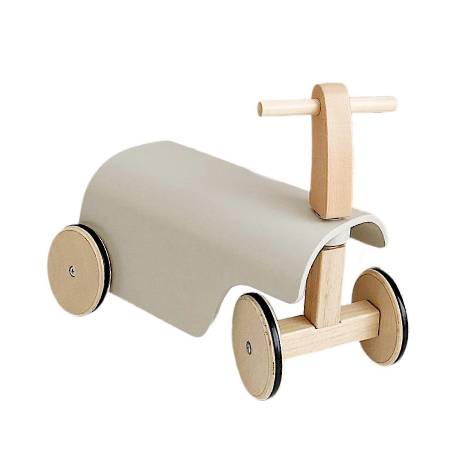 Lapset työntävät kävelylelua pyörillä Motoriset taidot tasapainopyörälelu lapsille