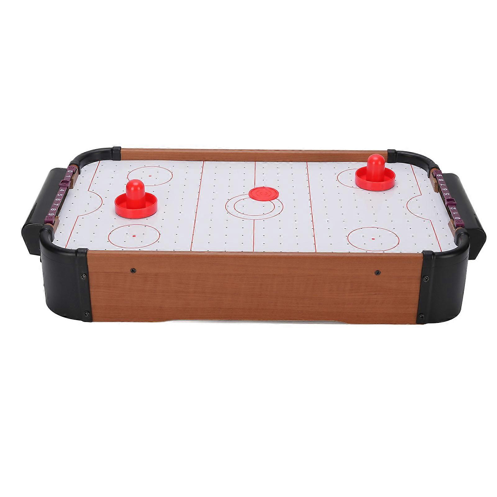 Interactive electronic table hockey game to improve reaction speed, family board game