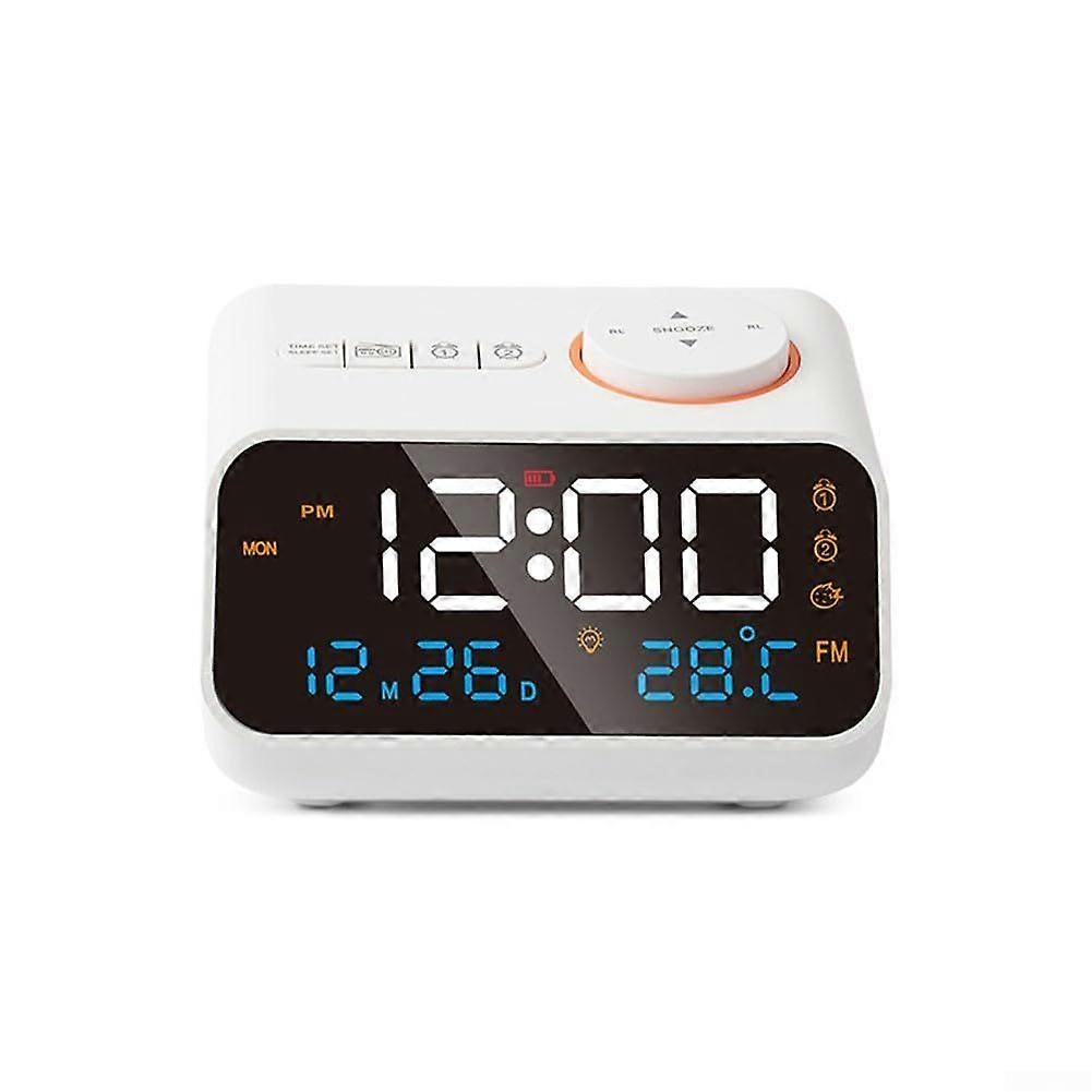 Digital alarm clock with FM radio, LCD display, thermometer and hygrometer (11.3 x 8.6 x 7.1 cm)