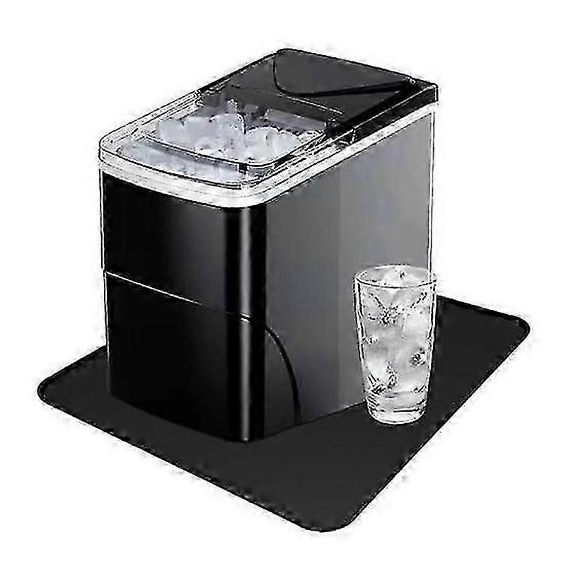 Portable countertop ice maker with absorbent drying mat