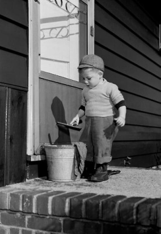 Boy cleaning window Poster