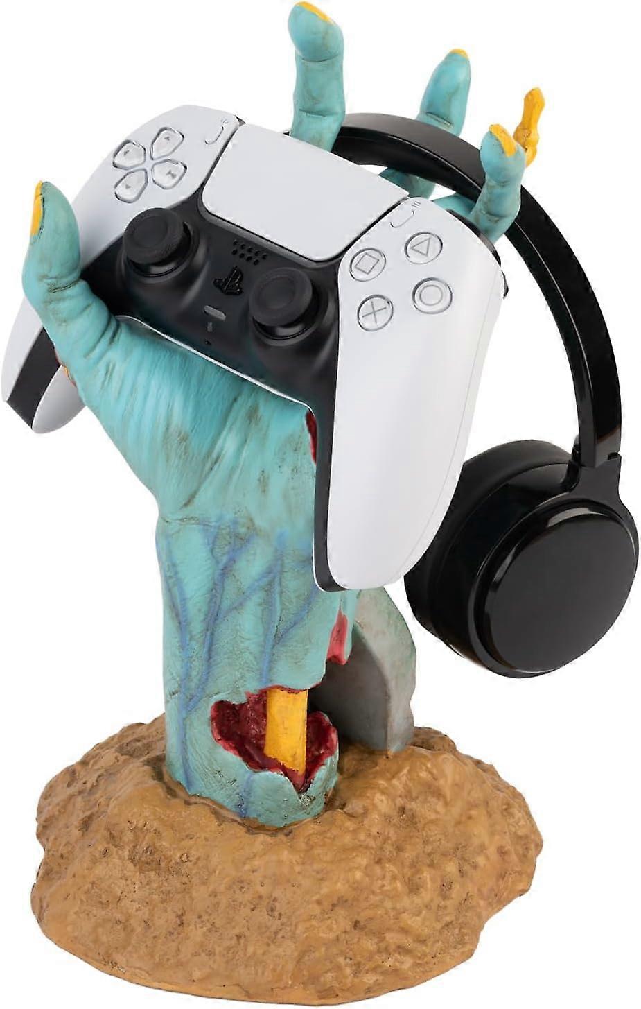 Game controller holder, One More Life figure, headphone stand, controller, gaming accessory.