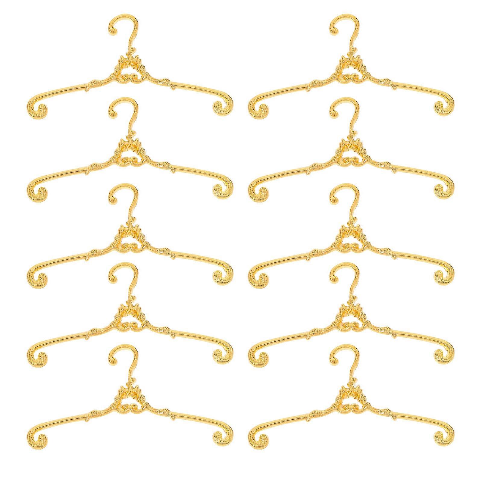 Here's a polished and engaging product description you can use for your **10pcs Mini Metal Doll Clothes Hangers**:
### 🐾 10pcs Mini Metal Doll