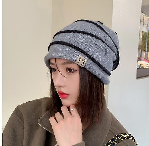 Chapeau à bord bouclé rayé pour femmes Automne et hiver Simple Chapeau tricoté All-match Protection auditive extérieure pour femmes Pullover résistant au froid Chapeau froid
