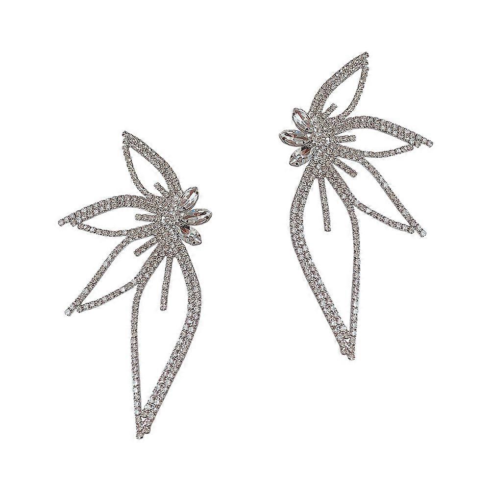 a polished product description based on your input:

 

**Butterfly Wing Clip Earrings – Hollow Flower Design, Lightweight Fake Ear Clips for Non