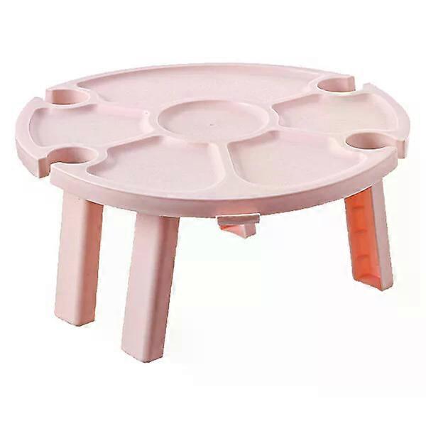Folding wine table, made of plastic, can hold 4 glasses and prevent food from rolling off