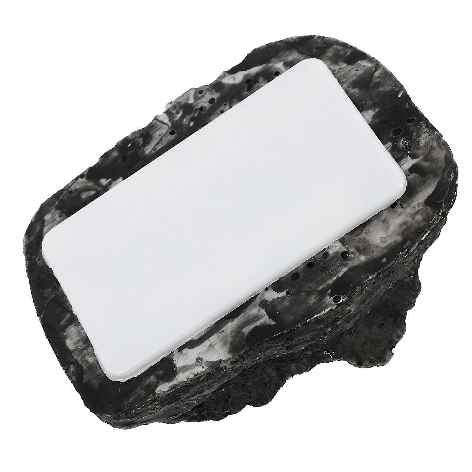 The **Fake Stone Key Hider** is a practical and discreet outdoor key storage solution designed to blend seamlessly into your garden or outdoor space.