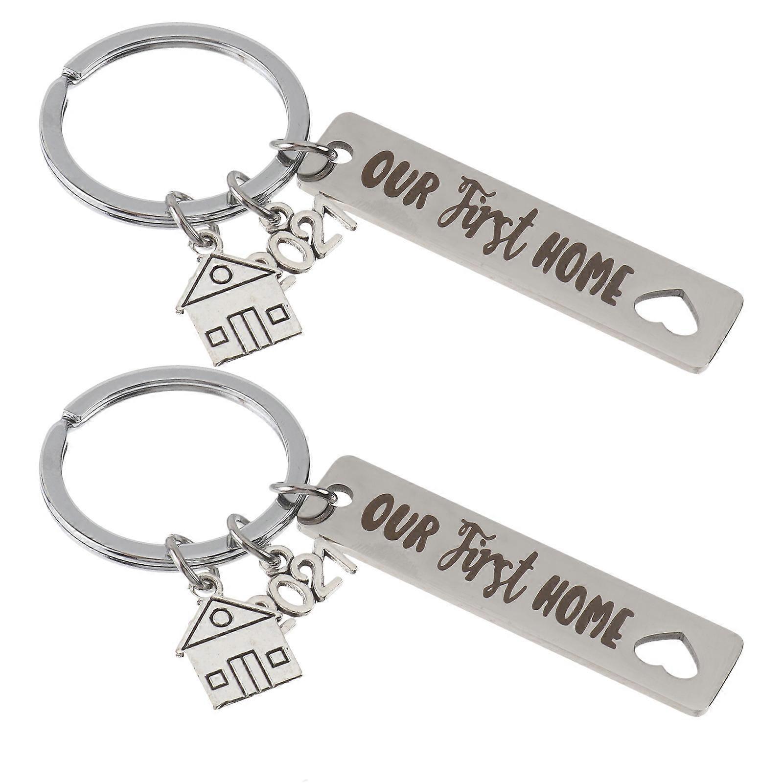 Here's a polished and professional product description based on your input:
**2pcs Creative Stainless Steel Keychain – "Our First Home" Themed –
