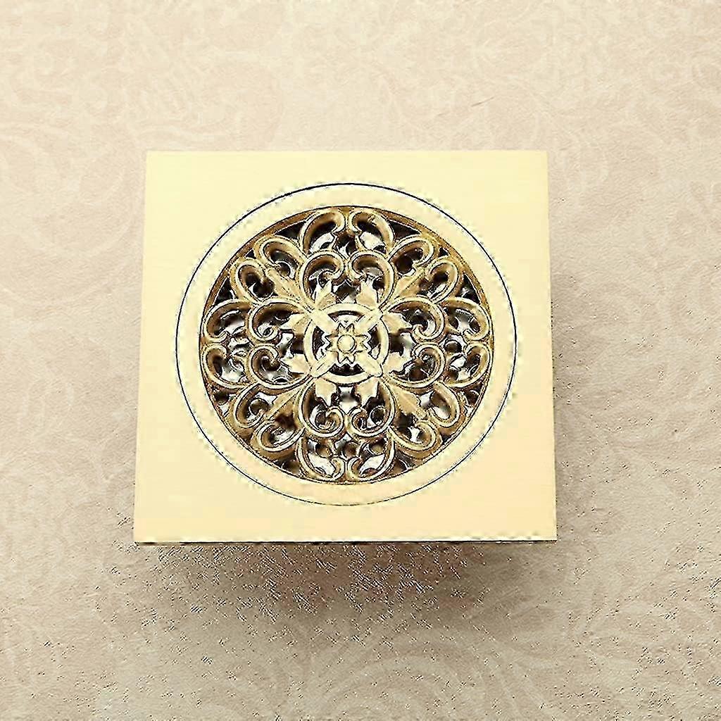 Floor drain for powder room with polished brass inlet and square shower design