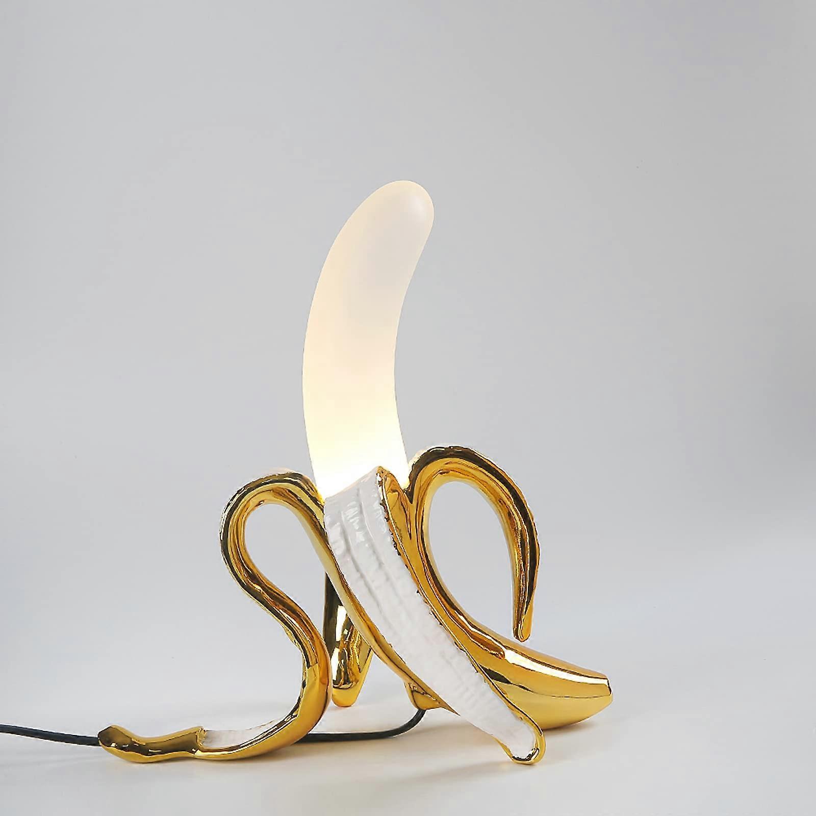Gold Banana Table Lamp with Unique Design and Soft Ambient LED Lighting for Bedroom or Office