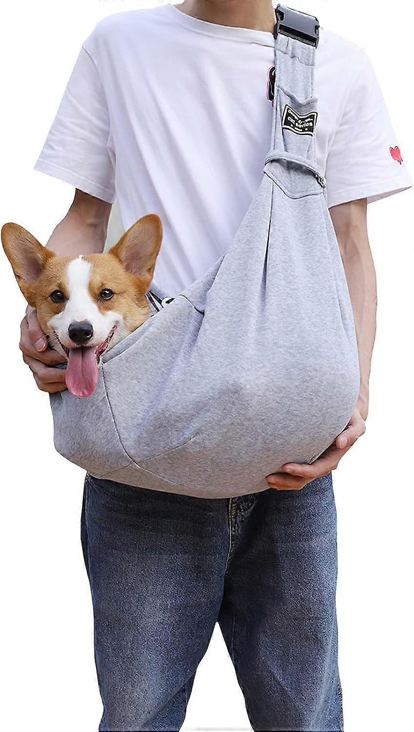 Adjustable pet carrier with shoulder strap for small dogs and puppies, breathable pet transport bag, hands for walks, subway rides, and gray.