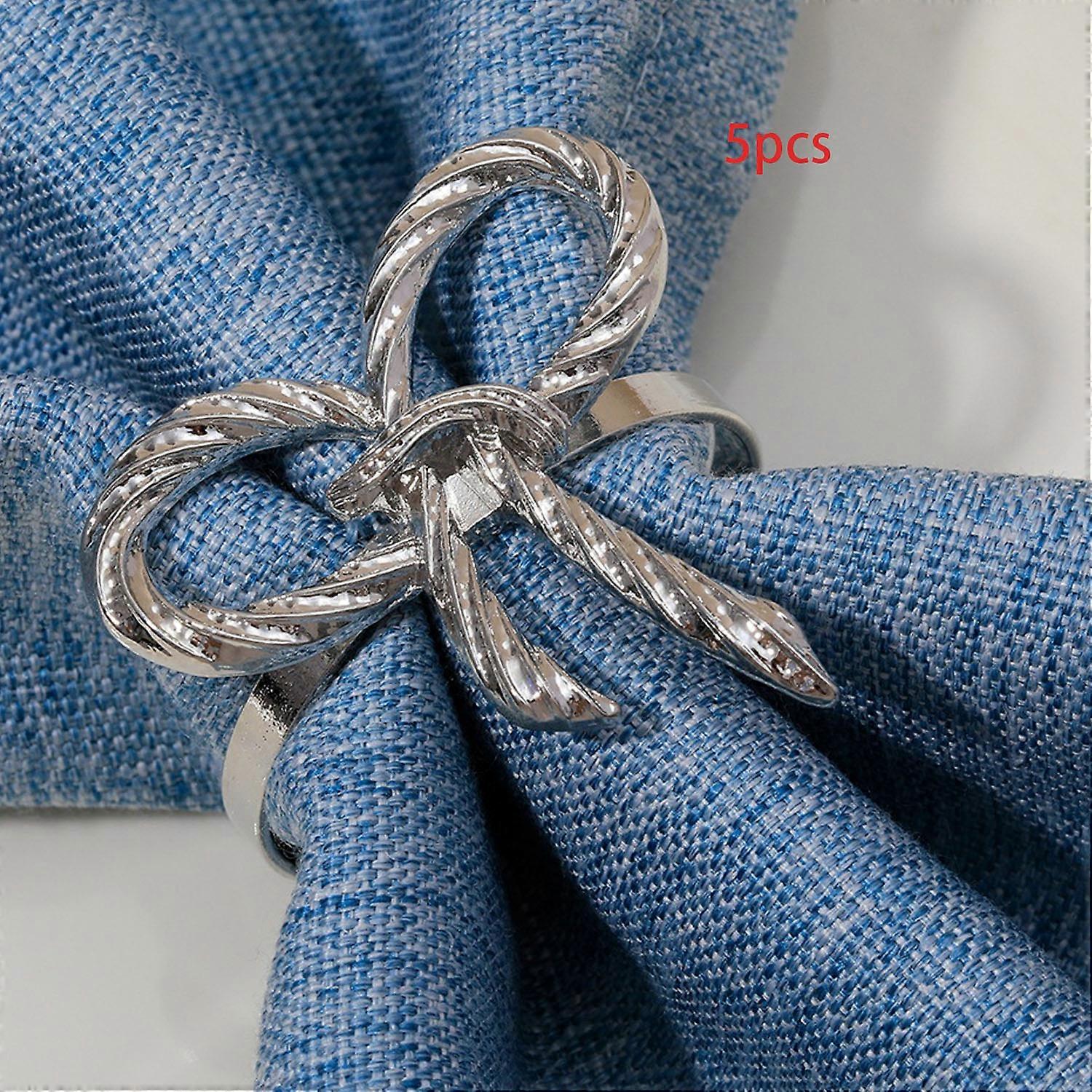 Förpackning med 5 servettringar i guld