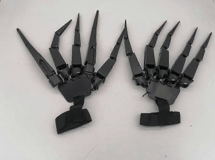 A pair of articulated fingers, 3D printed articulated finger extensions with flexible joints - Skeleton Hands