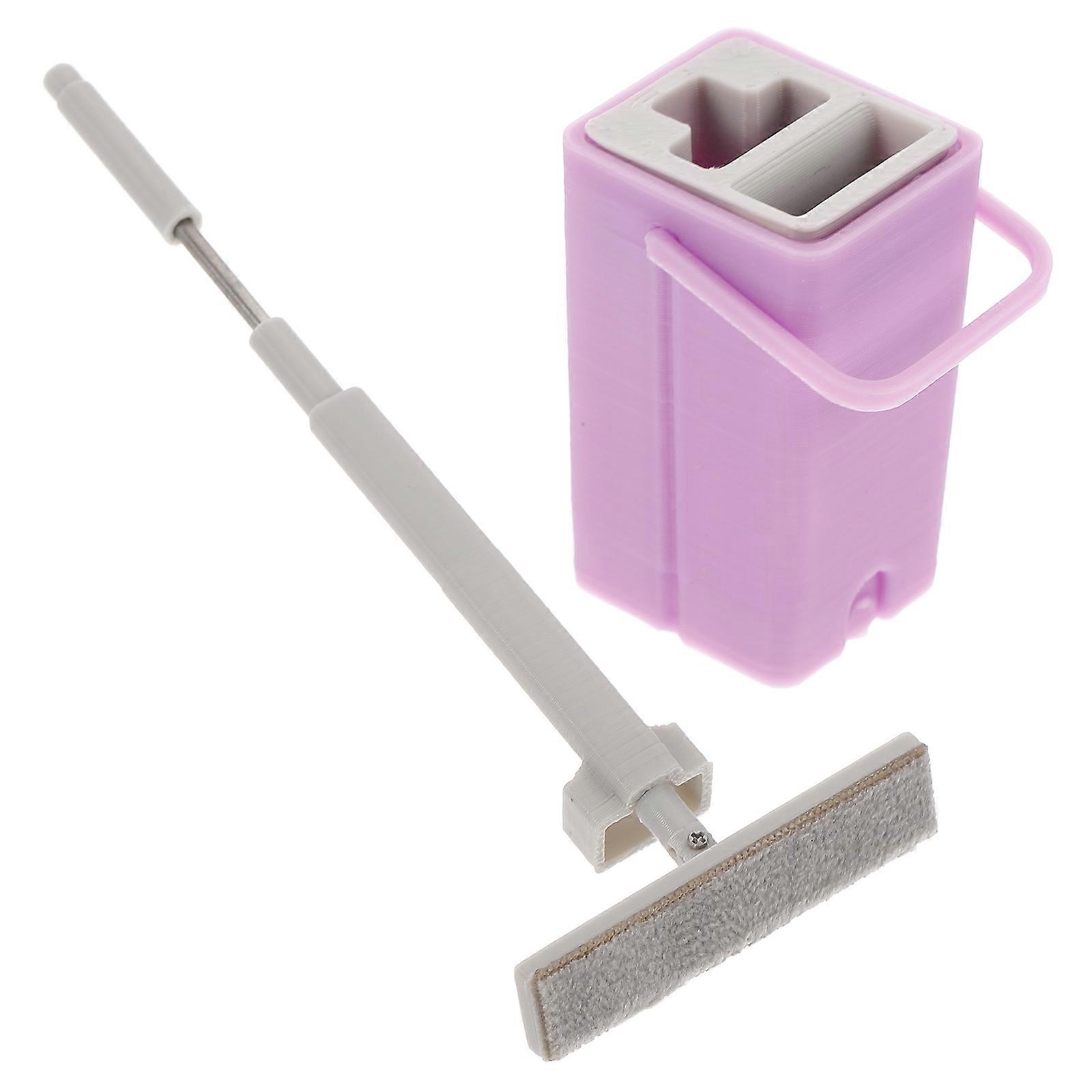 It sounds like you're describing a **miniature scale soft sponge mop with a purple bucket**, designed for **pretend play**, **dollhouse decor**, or