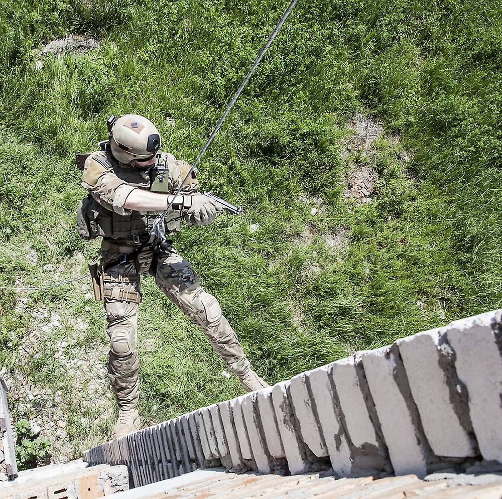 Soldier during assault rappelling exercises with weapons. Poster