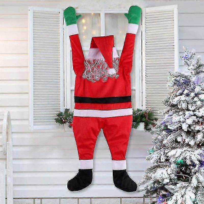 تسلق سانتا الجدار لتزيين الملابس وتعليق الحلي وهدايا عيد الميلاد