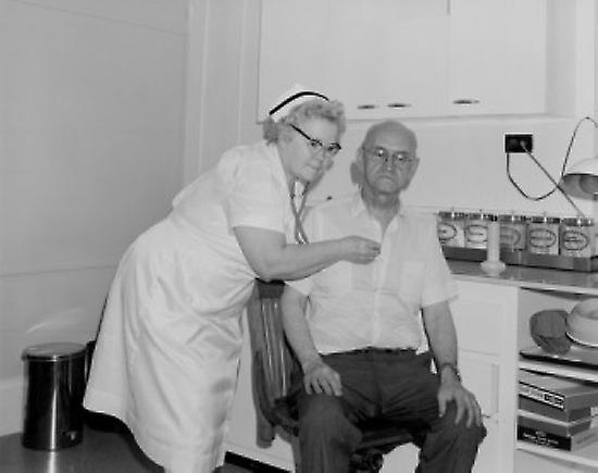 Nurse examining patient Poster