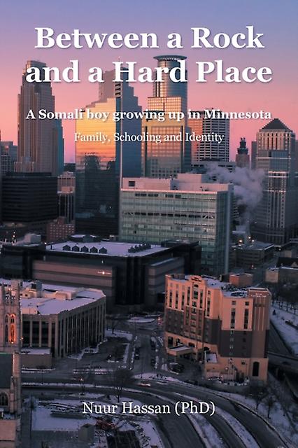 Between A Rock And A Hard Place by Nuur Hassan PhD Paperback