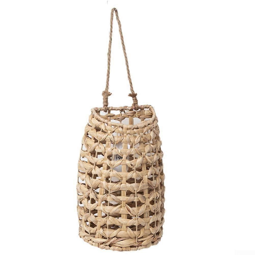 Handmade straw wall basket for displaying dried flowers and enhancing interior decor.